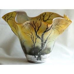 Decorative vase with embossed trees on a wavy background